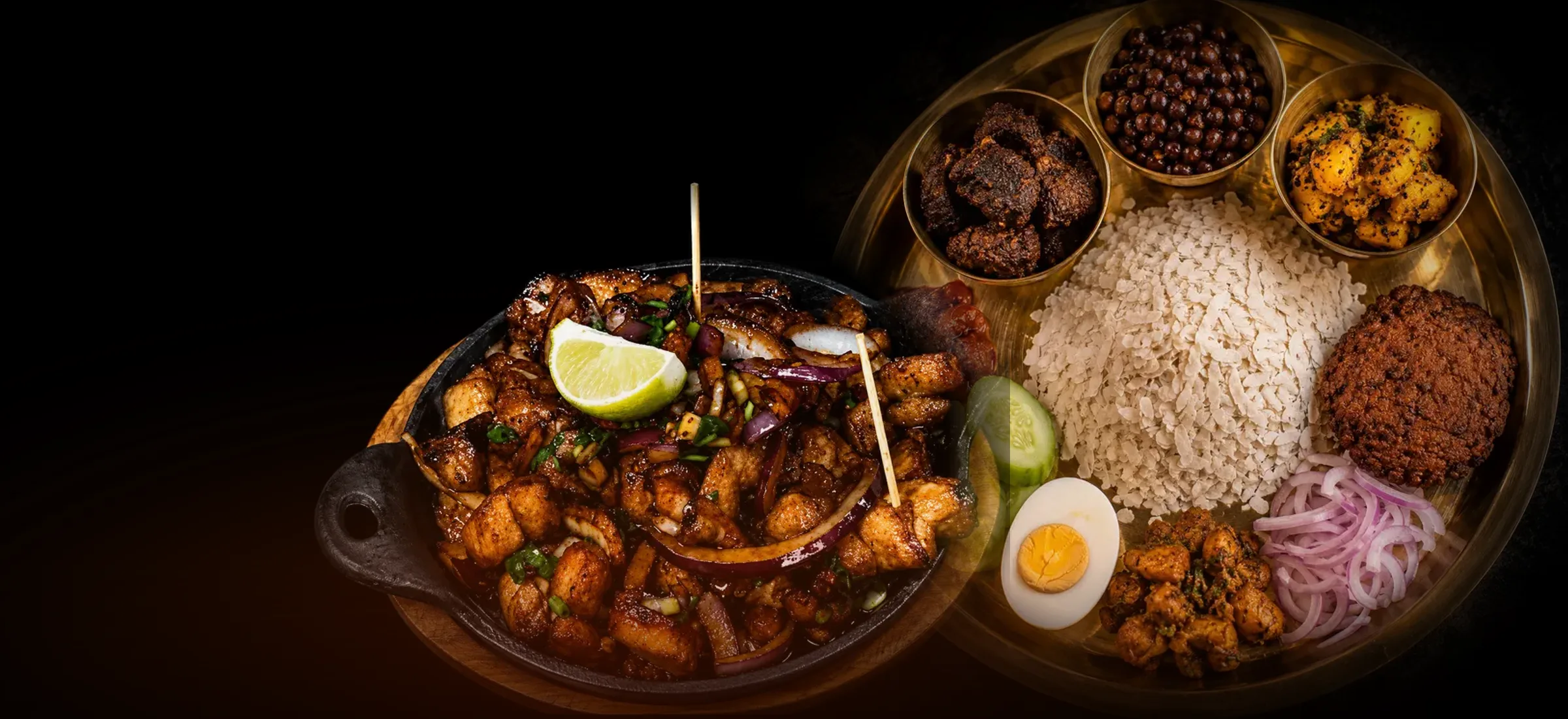 Chicken sekuwa sizzler and a samay baji brass platter, fresh off the hearth